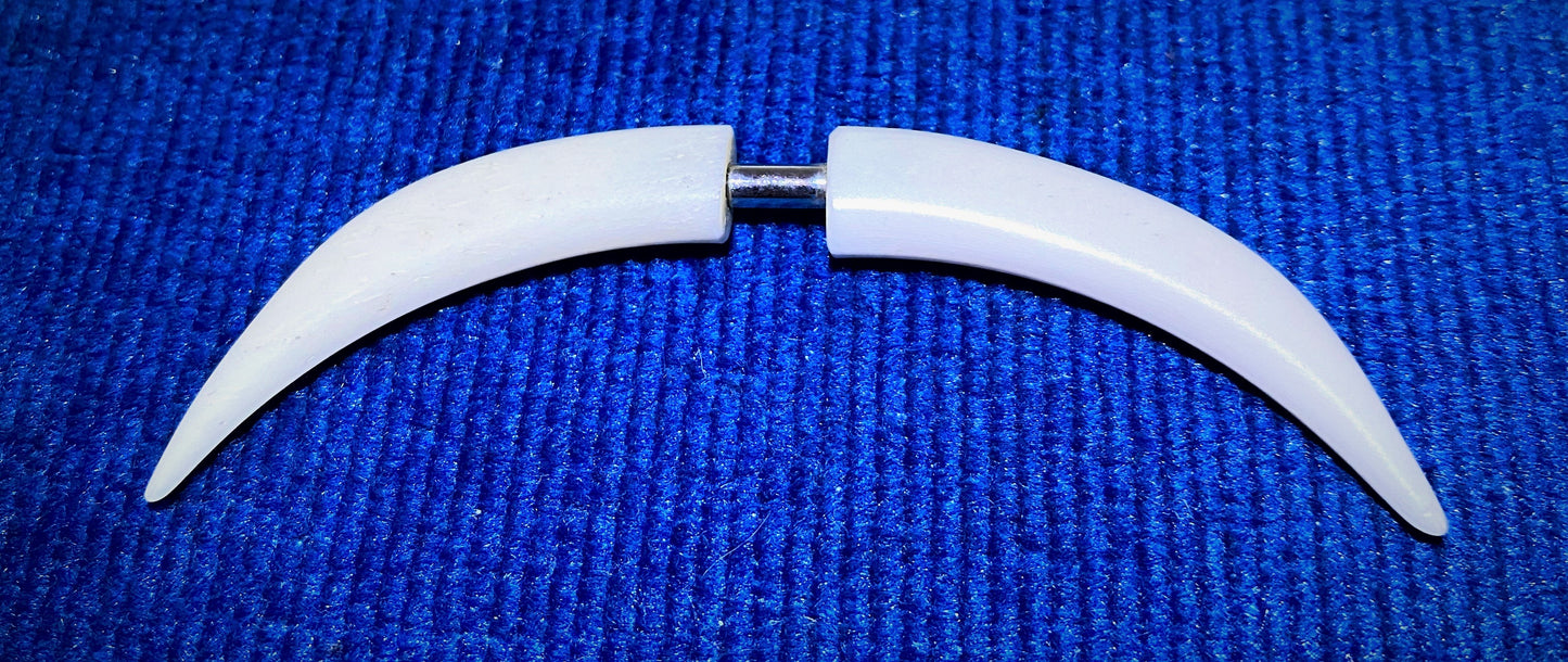 Septum Tusk - these bone tusk are retro items from the 1990s